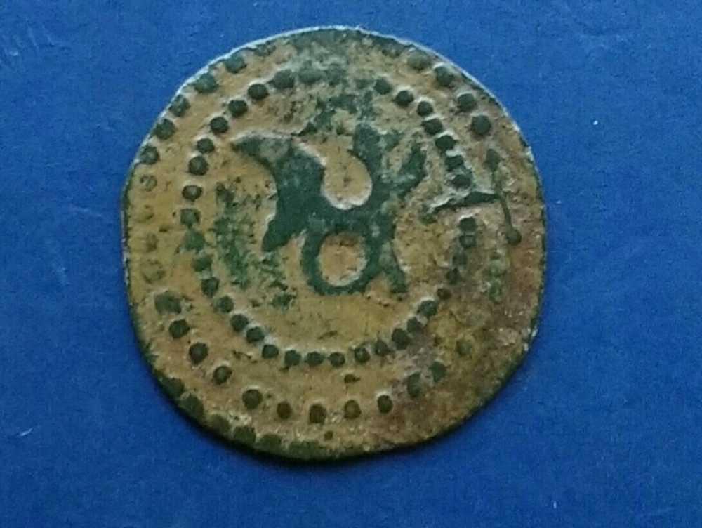A-Very-Unusual-Coin-Needs-Identifying